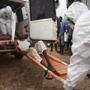 Healthcare workers loaded a man onto a ambulance in Kenema, Sierra Leone, on Sept. 24.