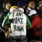 Police detained a protester during clashes in Ferguson, Mo., that followed the decision in the Michael Brown case.