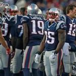11/23/14: Foxborough, MA: With the return of running back LaGarrette Blount (29), to New England, (seen recieveing the heroe's welcome by teammates at left when he left the game late in the New England romp), last weeks hero Jonas Gray (35) found himself benched by head coach Bill Belichick (not pictured). Quarterback Tom Brady is in the backround at right. The New England Patriots hosted the Detroit Lions in a regular season NFL game at Gillette Stadium. (Globe Staff Photo/Jim Davis) section:sports topic:Patriots-Lions (1)