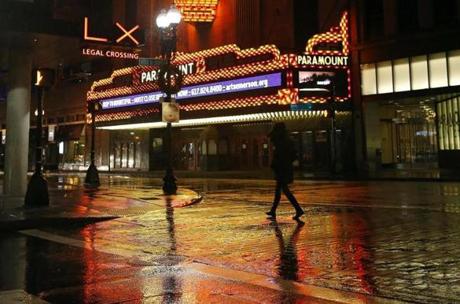 Streets in front of the Paramount Theatre were wet Wednesday night. 

