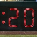 As the batter steps in, the umpire signals the pitcher that the 20-second clock is about to start. Sran Grossfeld.