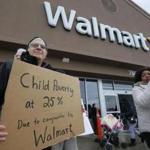 Employees and activists protested the chain?s wages and lack of full-time positions at the Lynn Walmart.