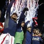 The Revolution's Jose Goncalves (far right) holds the MLS Eastern Conference Champion's Cup aloft as he and goalkeeper Bobby Shuttleworth (far left) and Jermaine Jones (second from left) and others celebrate.