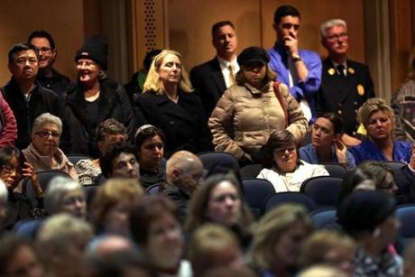Audience members listened to remarks during a public hearing at Quincy High School on Steward Health Care System's planned shutdown of Quincy Medical Center. 

