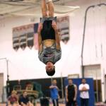 Newton North High junior Jonathan Wang, the defending all-state  champ in all six gymnastics events, practices with the team last week. 
