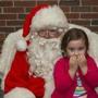 Kaajine Chentsova, 4, of North Quincy, spent some time with Globe Santa on Saturday in the rotunda at Faneuil Hall Marketplace.