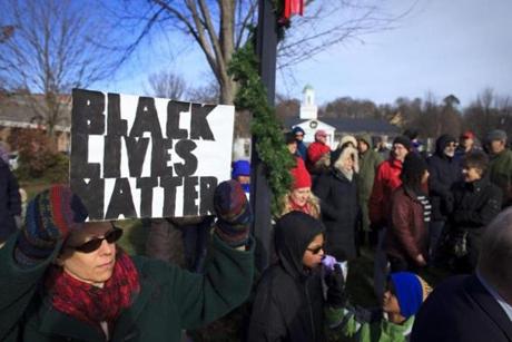 About 150 people attended a rally in Lexington about the police killings of two unarmed black men.
