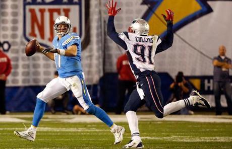 Chargers QB Philip Rivers looked to throw under pressure from Jamie Collins.
