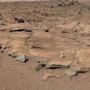 Beds of sandstone inclined to the southwest toward Mount Sharp and away from the Gale Crater rim.