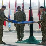 Lieutenant General Joseph Anderson (left) folded the flag during a ceremony in Kabul on Monday.