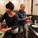 Instagram aficionados Linda and Jonathan Plazonja making dinner ? and photographing it ? in their Brookline kitchen. 