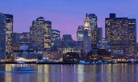 Boston?s skyline at dusk. 
