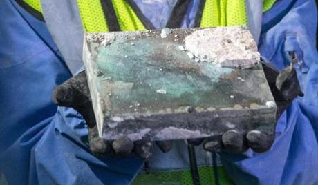 Workers took a corner block of granite out of the State House.
