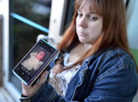 Lisa Cupan displayed a cell phone photo of her grandson, infant William Berry, after Christopher Berry, the child's father, pleaded guilty to involuntary manslaughter in his death. 
