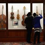 At Symphony Hall,  (from left) Jernyida George, 13, and STEP students Trinity Dickson, 9, and Angelina Wallace, 9, look over various period instruments.