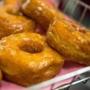 NEW YORK, NY - NOVEMBER 03: A Dunkin' Donuts employee displays a fresh tray of 