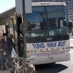 Passengers line up in Chinatown in New York City to board a Fung Wah bus to Boston.