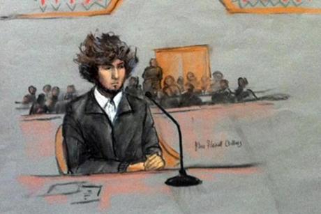 Dzhokhar Tsarnaev wore a shirt, dark sweater, and slacks during his appearance under tight security in US District Court.
