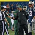 10/16/14: Foxborough, MA: Jets head coach Rex Ryan smiles as he shakes hands with some of the game officials before the game. Patriots quarterback Tom Brady is in foreground at far right. The New England Patriots hosted the New York Jets in a Thursday night NFL regular season game at Gillette Stadium. (Globe Staff Photo/Jim Davis) section: sports Patriots-Jets (1)