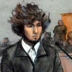 Dzhokhar Tsarnaev wore a shirt, dark sweater, and slacks during his appearance under tight security in US District Court.