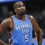 Oklahoma City Thunder center Kendrick Perkins waits to take foul shot against the Denver Nuggets in the first quarter of an NBA basketball game in Denver on Wednesday, Nov. 19, 2014. (AP Photo/David Zalubowski)