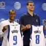 Rajon Rondo and Dwight Powell were introduced in Dallas on Friday. (AP Photo/The Dallas Morning News, G.J. McCarthy)