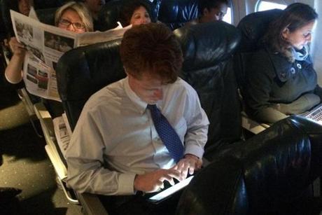 Representative Joseph Kennedy checked his e-mail on a recent shuttle to Washington D.C., a flight he takes often.
