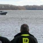 A Boston Police boat moved in so rescuers could save two people in the icy water off South Boston on Christmas Day.
