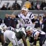 New England Patriots quarterback Tom Brady (12) points out the defense during the second half of an NFL football game against the New York Jets Sunday, Dec. 21, 2014, in East Rutherford, N.J. (AP Photo/Bill Kostroun)