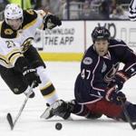 The Bruins' Loui Eriksson (left) and the Blue Jackets' Dalton Prout chase a loose puck during the first period. Jay LaPrete/Associated Press