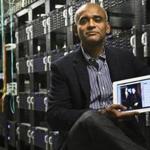 FILE - In this Thursday, Dec. 20, 2012 file photo, Chet Kanojia, founder and CEO of Aereo, Inc., poses with a tablet displaying his company's technology, in New York. The Supreme Court on Wednesday, June 25, 2014 ruled that Aereo has to pay broadcasters when it takes television programs from the airwaves and allows subscribers to watch them on smartphones and other portable devices. (AP Photo/Bebeto Matthews, File)