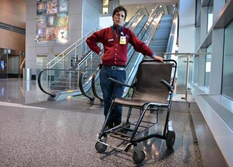 Raduane Fadel, a wheelchair attendant at Logan Airport, will see his pay rise to $10 an hour from $8 an hour as the first phase of the state minimum wage hike goes into effect.
