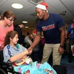 Patriots linebacker Darius Fleming greeted patients at Children?s Hospital after a Boston Pops concert.
