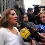 Marwa Omara, left, fiancee of imprisoned Al-Jazeera English's Egyptian-Canadian journalist Mohamed Fahmy, spoke to the press in Cairo, Egypt, on Jan. 1.  