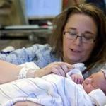Boston, MA 1/1/15 Donna Hill (cq) holding her daughter, Rylee Margaret Weigman (cq) the first baby was born in the Boston area (12:43 am, 8 pounds 4 ounces and 20 inches long) at Mass General Hospital on January 1, 2015. () Topic: 02baby Reporter: Rebecca Fiore
