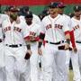 Boston Red Sox players walk on the field after receiving their World Series rings during pre-game ceremonies before a baseball game between the Red Sox and the Milwaukee Brewers on opening day at Fenway Park in Boston, Friday, April 4, 2014. (AP Photo/Michael Dwyer)