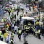 In this April 15, 2013 file photo, medical workers aid injured people at the finish line of the Boston Marathon. 