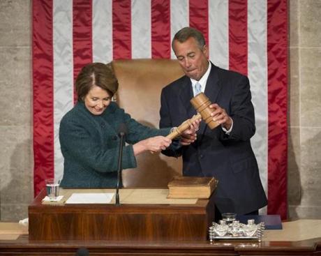 House Speaker John Boehner was handed the gavel from House minority leader Nancy Pelosi after being re-elected for a third term to lead the 114th Congress.

