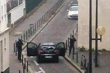 Armed gunmen faced police officers near the offices of the French satirical newspaper Charlie Hebdo in Paris on Wednesday.
