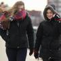 Australian exchange students Tamara Gleeson, left, and Hayley Jarvis braved the wind as they crossed the Massachusetts Avenue Bridge in Cambridge Wednesday. 