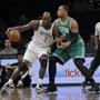 epa04550258 Brooklyn Nets forward Kevin Garnett (L) dribbles against Boston Celtic forward Jared Sullinger in the first half in their NBA game at the Barclay's Center in Brooklyn, New York, USA, 07 January 2015. EPA/PETER FOLEY CORBIS OUT