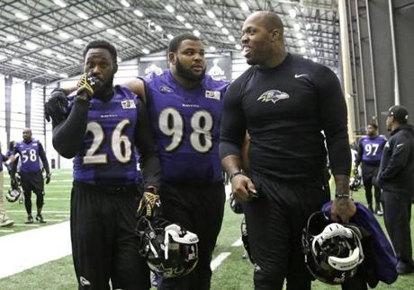 Terrell Suggs (right) will appear in his fourth  playoff game at Gillette Stadium, joined by first-timers Matt Elam (left) and Brandon Williams.

