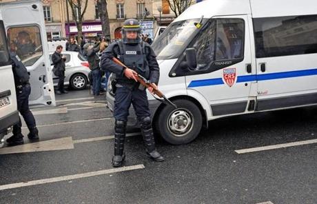 Police SWAT squads descended on the area of the attack in Paris where at least five hostages were being held.
