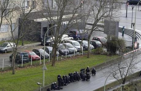 Police took positions near the market in Paris.
