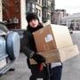 Personal concierge Kristin Cantu takes clients? packages to the Post Office at Kenmore Square. She said the boxes contained Christmas gifts that were being returned.