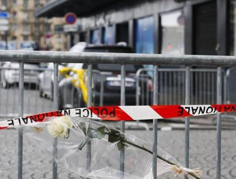 A flower was left in tribute to the victims of Friday?s shooting at a Kosher market in Paris. A suspect in that attack and in the shooting of a police officer, Hayat Boumeddiene, remains at large.
