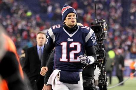 Tom Brady heads off the field after throwing for three touchdowns and leading the Patriots to a come-from-behind victory over the Ravens in Saturday?s AFC divisional-round game. (Photo by Jim Rogash/Getty Images)
