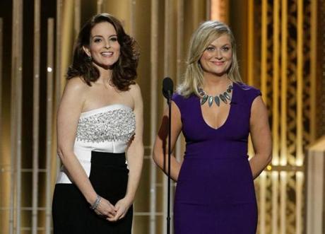 Tina Fey (far left) and Amy Poehler hosting the Golden Globes telecast.
