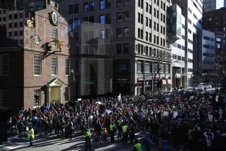 Demonstrators gathered in front of the Old State House Monday in Boston during a nationwide 