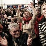 Syriza supporters in Athens cheered exit poll results on Sunday that indicated the opposition radical leftist party was headed toward victory.